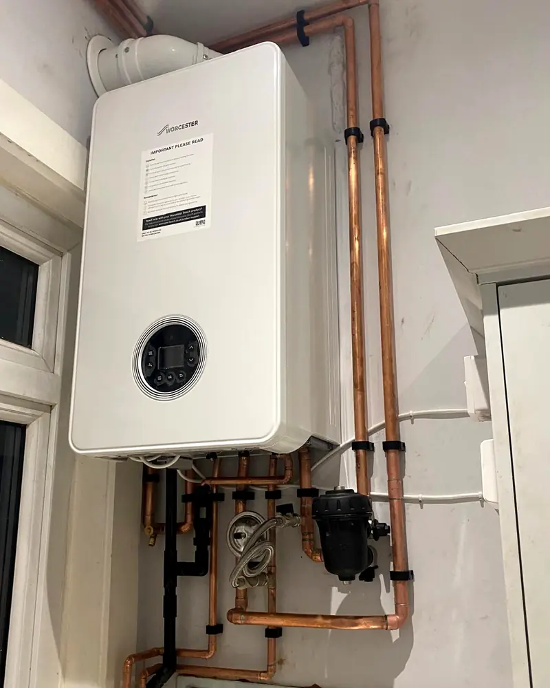 White Worcester combi boiler with neat copper pipework